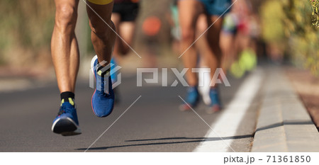 Marathon running race, people feet on city road 71361850