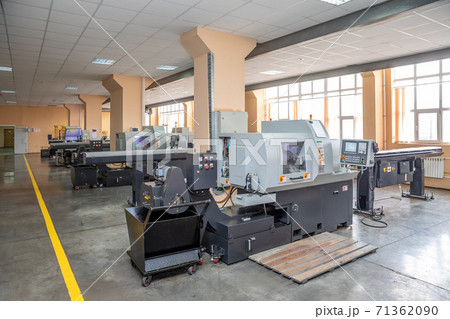 a number of CNC machines in the production room. Interior of industrial premises a number of CNC machines in the production room. Interior of industrial premises 71362090