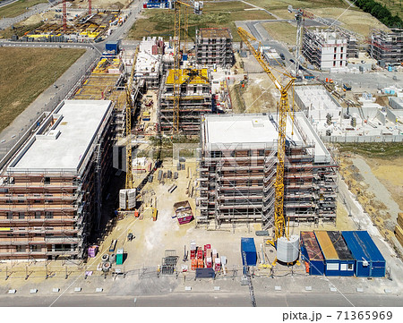 Aerial view of three large shell buildings  71365969