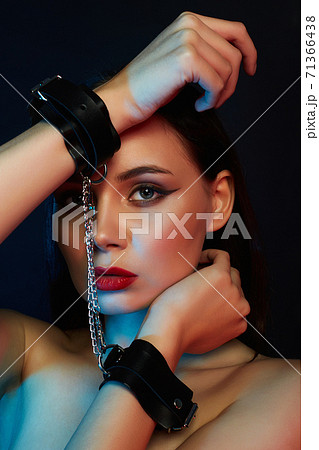 Girl in handcuffs. color lights Girl in handcuffs. color lights 71366438