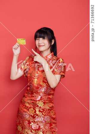 woman wear cheongsam with a credit card shopping woman wear cheongsam with a credit card shopping 71366692