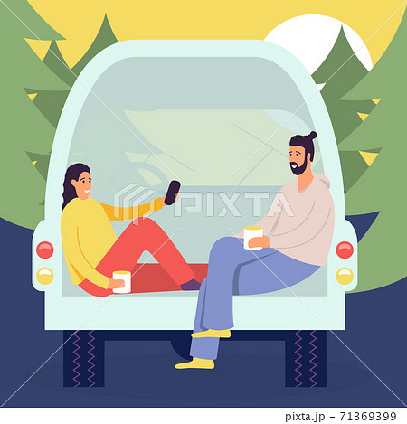 Cheerful young couple enjoy vacation sitting in rear of van, people in camper van, picnic in the forest in the house on wheels 71369399