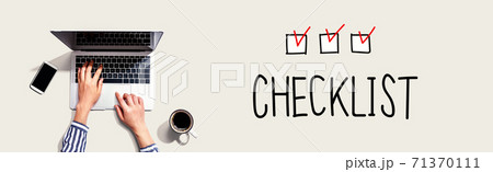 Checklist with person using laptop Checklist with person using laptop 71370111
