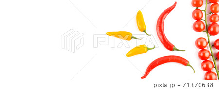 Cherry tomatoes, cayenne and chili pepper isolated on a white background. Wide photo. Free space for text. 71370638