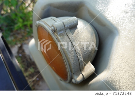 an old military green truck front light an old military green truck front light 71372248