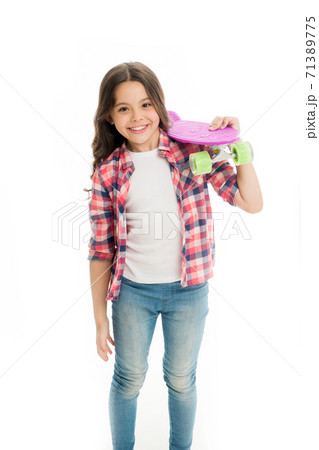 Little child smile with penny board isolated on white. Happy skater girl.  71389775