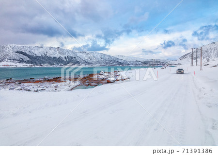 Fabulous snowy winter scene of Vestvagoy island with snowy mountain peaks on Lofoten Islands Fabulous snowy winter scene of Vestvagoy island with snowy mountain peaks on Lofoten Islands 71391386