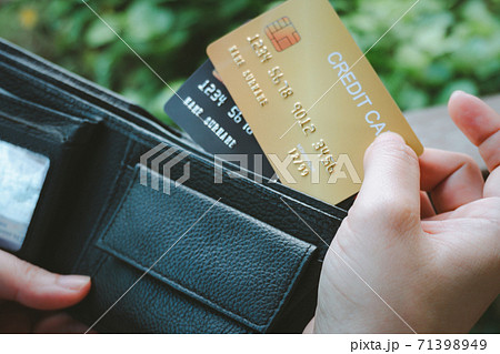 Woman hand open wallet showing credit card 71398949