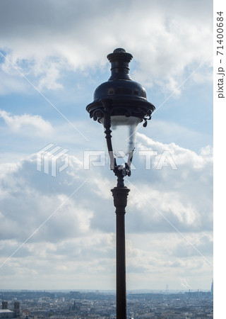 Closeup of street light on roofs of Paris from Montmartre quarter background Closeup of street light on roofs of Paris from Montmartre quarter background 71400684