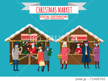 Christmas Market holiday fairs or festive on city square. In conditions of the COVID 2019 pandemic sellers in medical masks, Social distancing. People walk and buy between canopy, stalls souvenirs hot Christmas Market holiday fairs or festive on city square. In conditions of the COVID 2019 pandemic sellers in medical masks, Social distancing. People walk and buy between canopy, stalls souvenirs hot 71400702