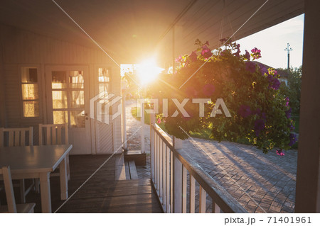 Flowers hang on porch. Flowers hang on porch. 71401961