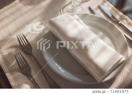 White napkin and plate. White napkin and plate. 71401975