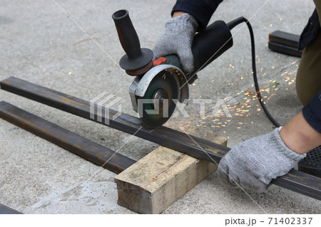 Cutting metal structures with an angle grinder. Cutting metal structures with an angle grinder. 71402337