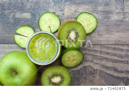 Green smoothie with cucumber, kiwi and apples Green smoothie with cucumber, kiwi and apples 71402875