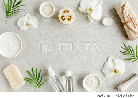 Spa treatment concept. Natural,Organic spa cosmetics products, sea salt, massage brush. Spa background with a space for a text, flat lay, top Spa treatment concept. Natural,Organic spa cosmetics products, sea salt, massage brush. Spa background with a space for a text, flat lay, top 71404567