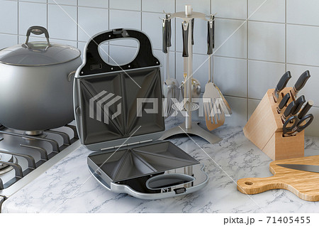 Opened sandwich maker on the kitchen table. 3D rendering Opened sandwich maker on the kitchen table. 3D rendering 71405455
