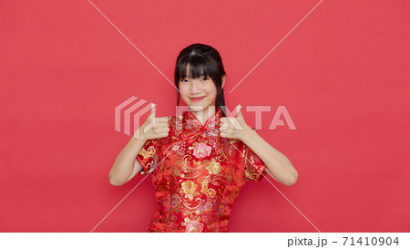 Cute woman wear cheongsam and show something 71410904