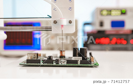 Debugging electronics device. PCB witch microcontroller in electronics laboratory 71412757