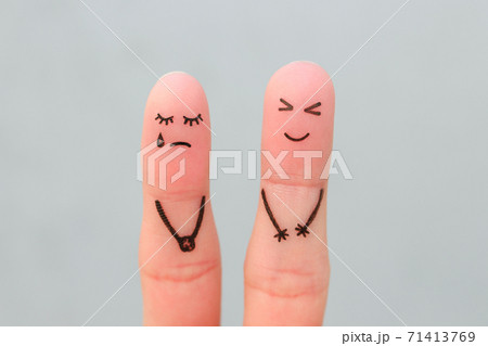 Fingers art of couple. Woman cries, man laughs. 71413769