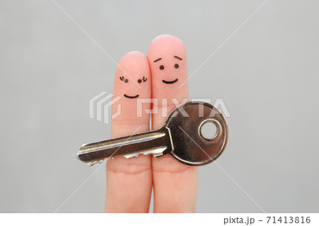Fingers art of happy couple. Family holds house key. Fingers art of happy couple. Family holds house key. 71413816