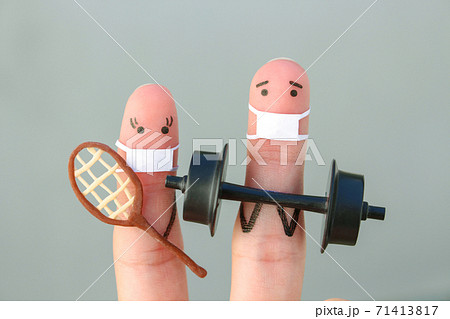 Fingers art of happy couple in medical mask from COVID-2019. Concept of family in sports. 71413817
