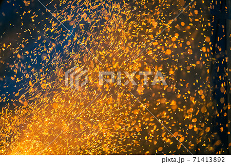 Flame and fire spark with bokeh on dark abstract background Flame and fire spark with bokeh on dark abstract background 71413892