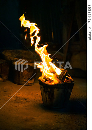 Flame and fire spark with bokeh  from burning charcoal on dark abstract background 71413898