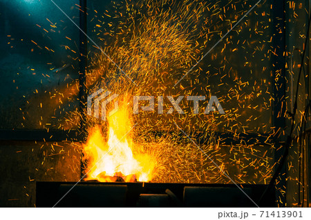 Flame and fire spark with bokeh from burning charcoal on dark abstract background Flame and fire spark with bokeh from burning charcoal on dark abstract background 71413901