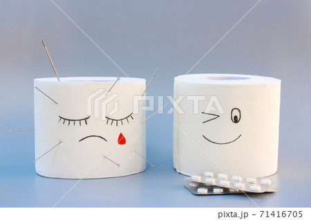 Toilet paper and pills. Concept of hemorrhoid treatment. 71416705