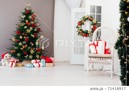 Christmas tree pine with new year gifts holiday red decoration decor gray background 71418917