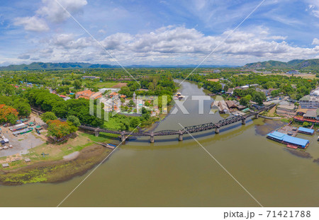 Aerial view of River Kwai Bridge with train rail way with Chao Phraya River, Tha Ma Kham, Mueang Kanchanaburi District, Thailand. Aerial view of River Kwai Bridge with train rail way with Chao Phraya River, Tha Ma Kham, Mueang Kanchanaburi District, Thailand. 71421788