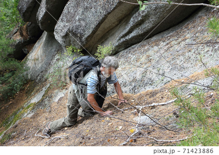 Man climbing a rock, Altai mountains Man climbing a rock, Altai mountains 71423886