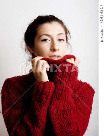 young pretty woman in sweater and scarf all over her face, lifestyle people winter concept young pretty woman in sweater and scarf all over her face, lifestyle people winter concept 71424817