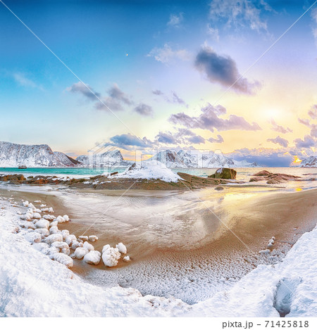 Fantastic winter view of Haukland beach during sunset with lots of snow and snowy mountain peaks Fantastic winter view of Haukland beach during sunset with lots of snow and snowy mountain peaks 71425818