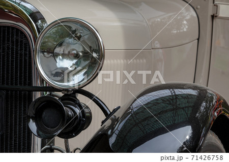 Old retro car lamp. Classic vintage vehicle front Old retro car lamp. Classic vintage vehicle front 71426758