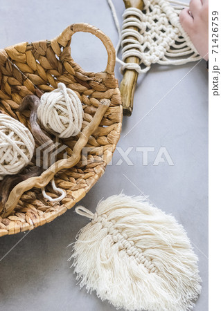 Handmade knitting macrame. Boho lifestyle. Hobby concept. Vertical frame 71426759