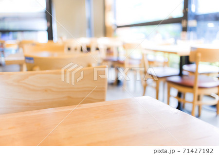 Modern interior of coffee shop with selective focusing  on wooden top table for montage product display 71427192