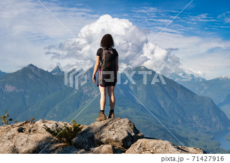 Adventurous Girl Hiking on top of Tin Hat Mountain 71427916