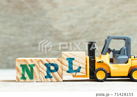 Toy forklift hold letter block l to complete word NPL (Abbbreviation of Non Performing Loan, Non-Patent Literature) on wood background Toy forklift hold letter block l to complete word NPL (Abbbreviation of Non Performing Loan, Non-Patent Literature) on wood background 71428155