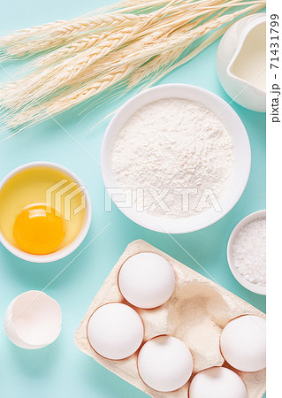 Ingredients for baking on light blue background. 71431799