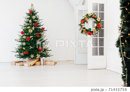 Christmas tree pine with gifts for the new year interior of the white room Christmas tree pine with gifts for the new year interior of the white room 71433759