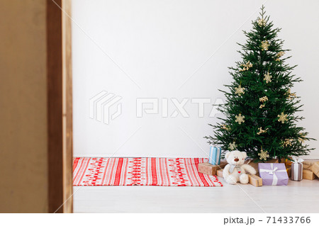 Christmas tree pine with gifts for the new year of the white room 2021 2022 Christmas tree pine with gifts for the new year of the white room 2021 2022 71433766