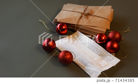 Christmas envelopes with a medical mask and red Christmas envelopes with a medical mask and red 71434385