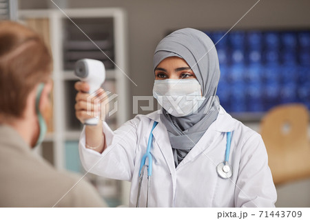Doctor checking the temperature 71443709