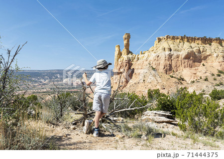 young boy looking at Chimney Rock, through a protected canyon landscape young boy looking at Chimney Rock, through a protected canyon landscape 71444375