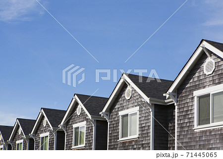 Row of houses, all the same, pitched roof and upstairs window Row of houses, all the same, pitched roof and upstairs window 71445065
