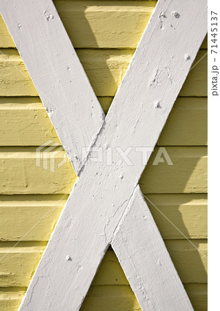Building exterior, wood cladding, cross beams, white and yellow woodwork Building exterior, wood cladding, cross beams, white and yellow woodwork 71445137