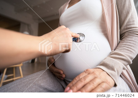 Happy pregnant woman visit gynecologist doctor at hospital or medical clinic for pregnancy Happy pregnant woman visit gynecologist doctor at hospital or medical clinic for pregnancy 71446024