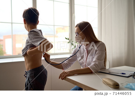 Cute boy with pleasure visiting pediatrician, scheduled check up of babys health, appointment with Cute boy with pleasure visiting pediatrician, scheduled check up of babys health, appointment with 71446055