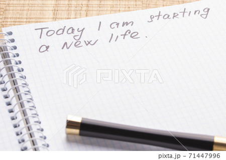 Top view workplace notebook and pen on wood table background, retro effect. The inscription - today I begin a new life. The concept of renewal and lifestyle changes 71447996